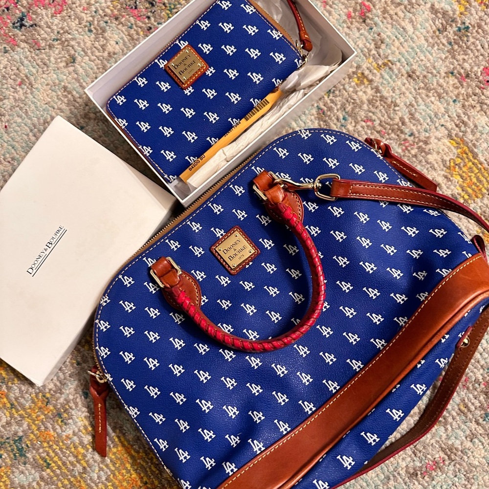 Dooney and Burke handbag with crossbody strap. Matching wallet . Leather.